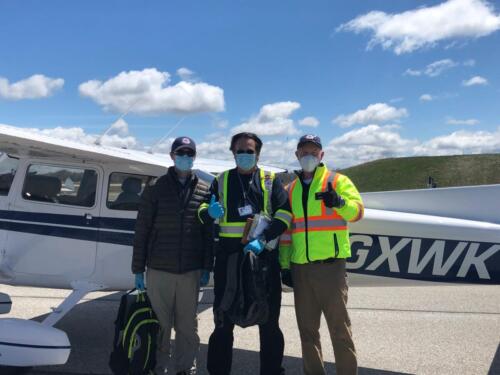 Pilot, Navigator and Spotter ready to go. Safety means wearing a mask and gloves to protect your fellow volunteers.